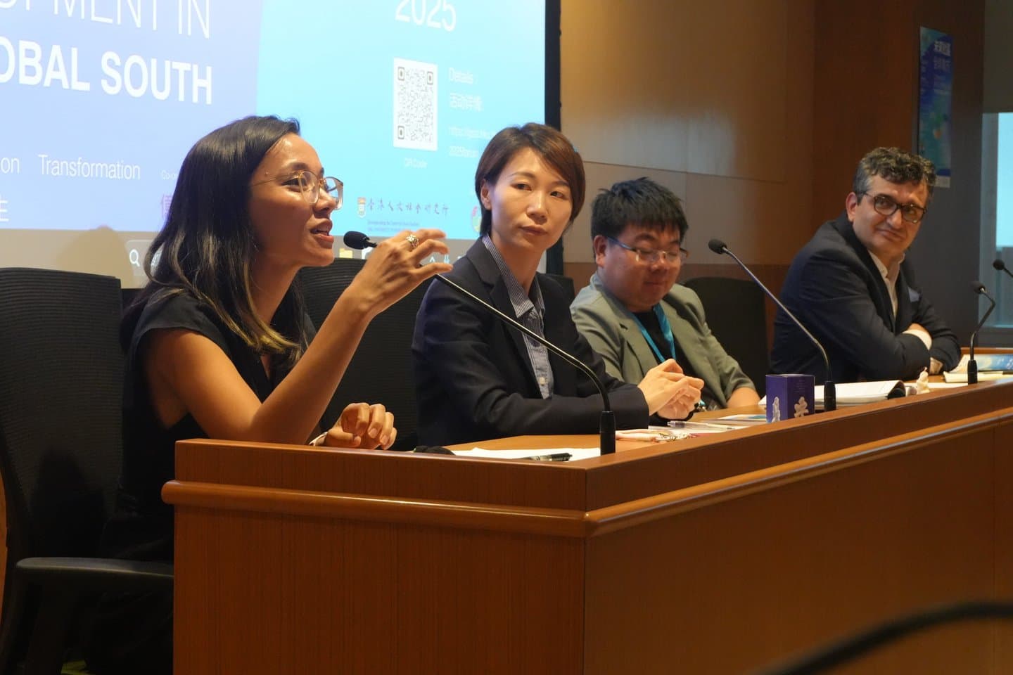 A woman speaking during a forum panel discussion